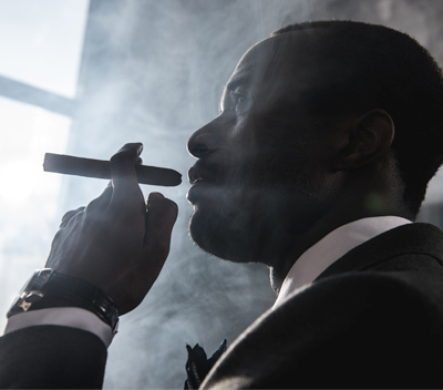 African American Man Smoking Cigar